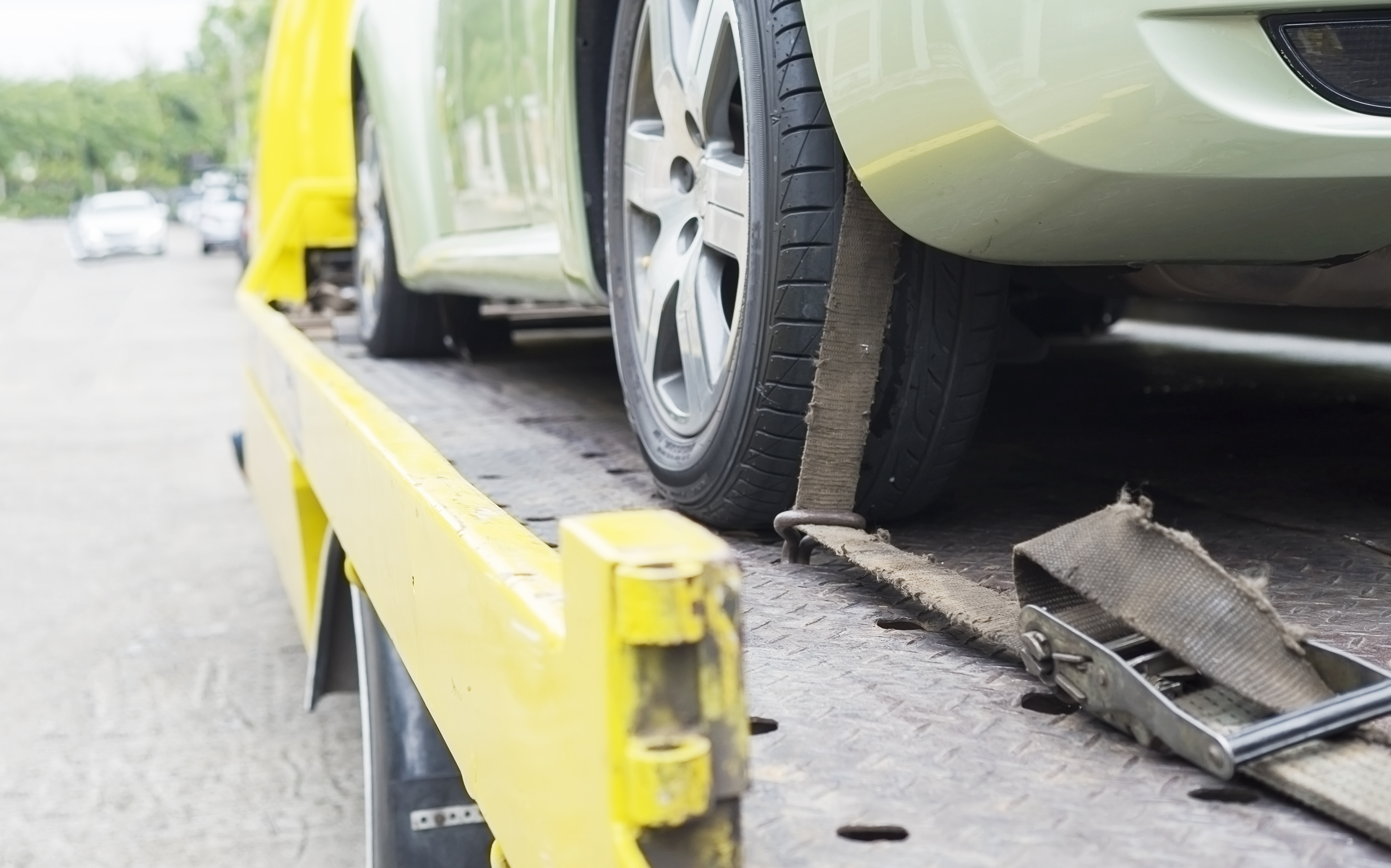 Car being loaded onto recovery truck